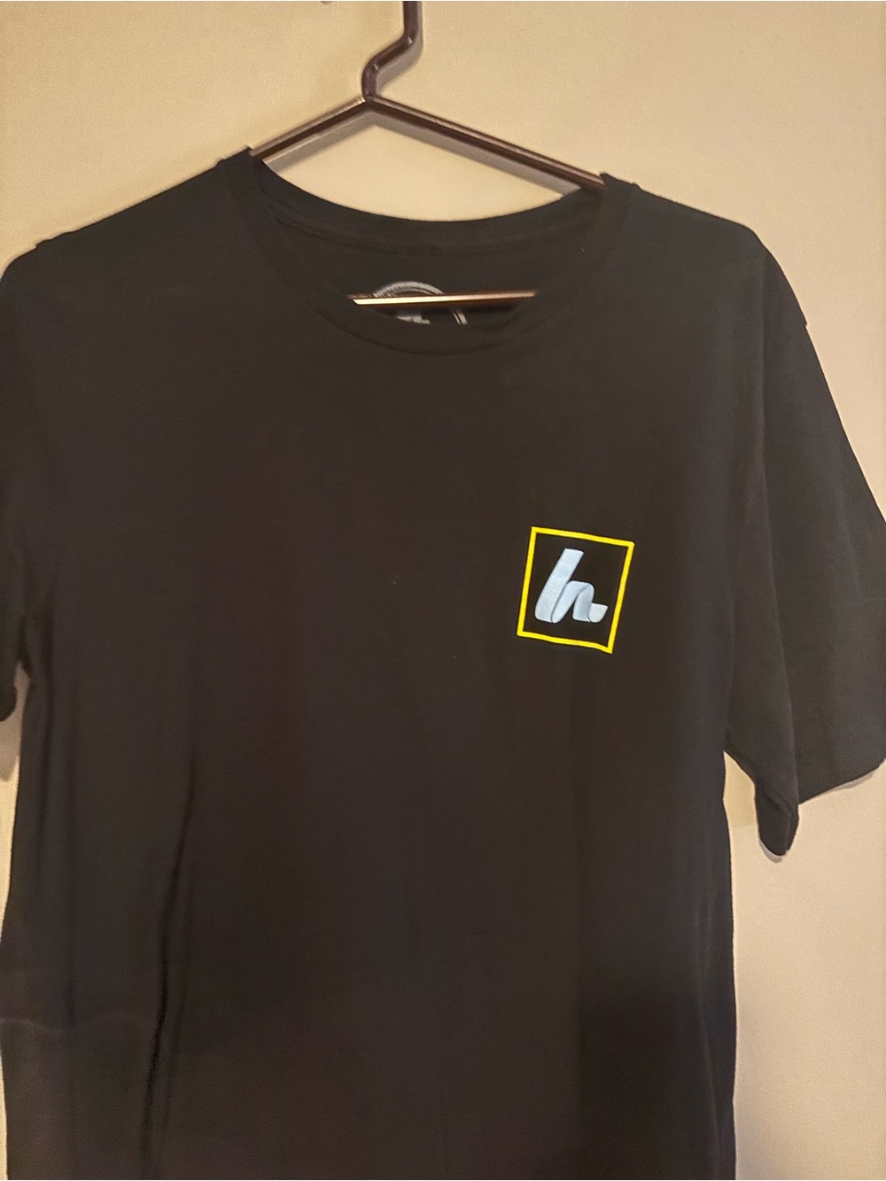Black Howies Hockey Tape  Short-Sleeve Graphic Pocket T-Shirt with Yellow Accent